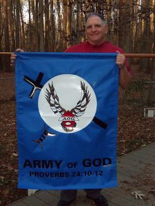 450px-Donald_Spitz_holds_Army_of_God_Banner