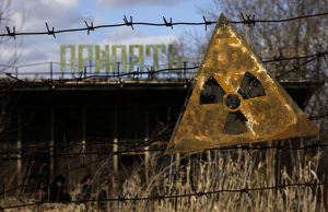 nuclear bomb effects A radioactive sign hangs on barbed wire outside a café in Pripyat.