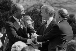 Sadat_Carter_Begin_handshake_(cropped)_-_USNWR